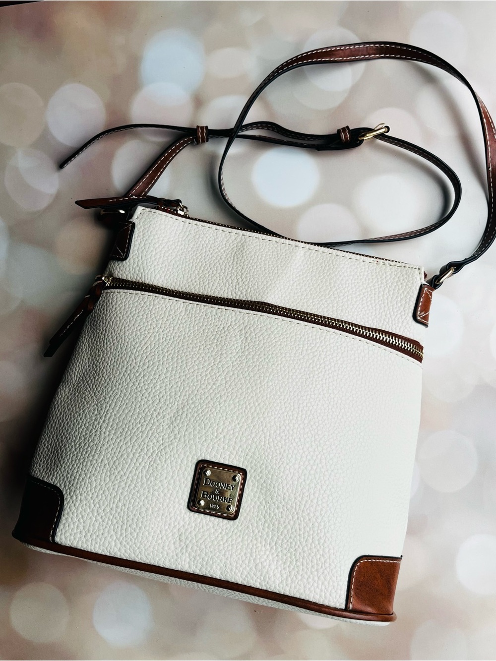 Dooney & Bourke White Pebbled Leather Crossbody with Brown Trim